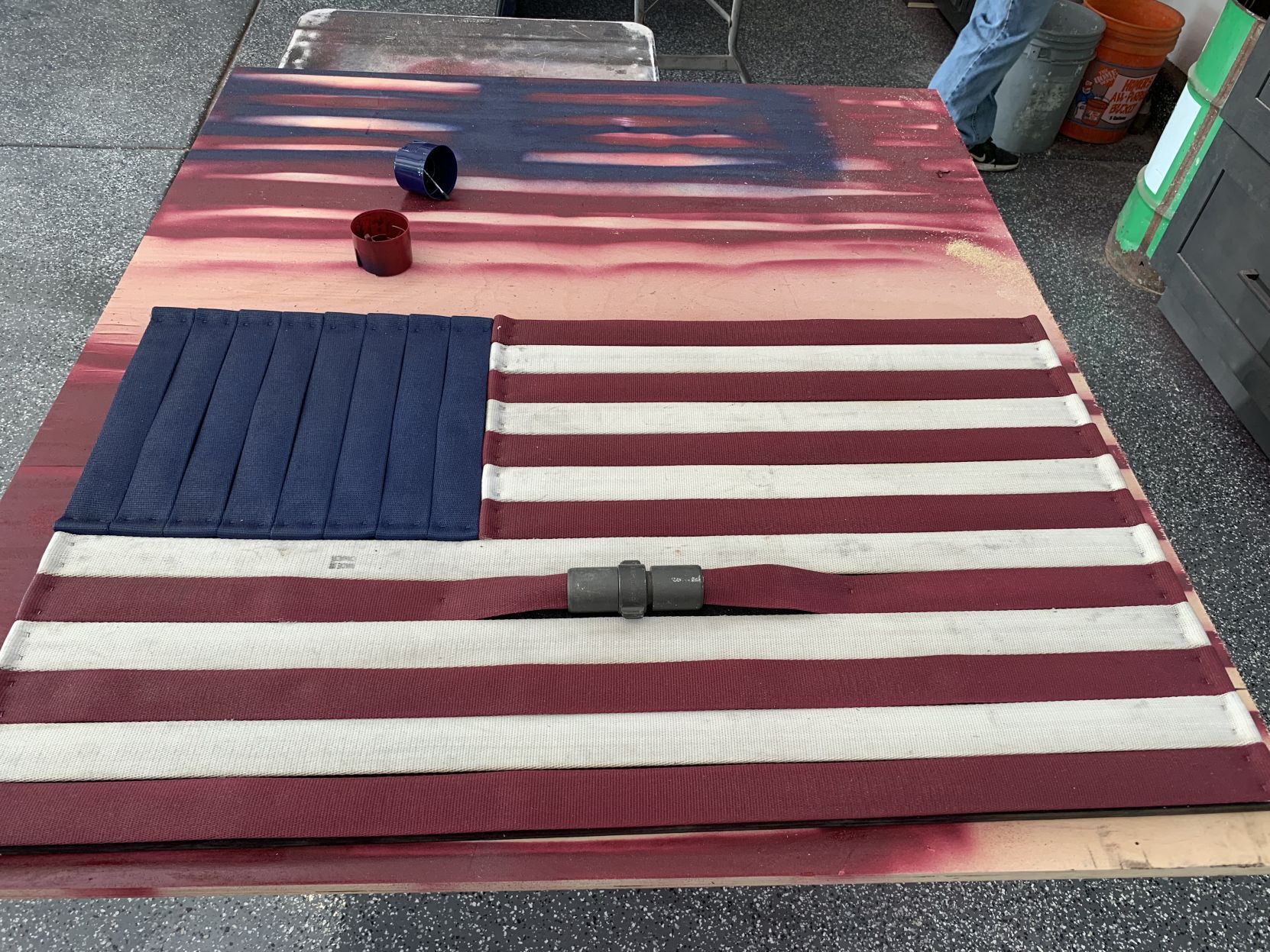Making flags from recycled fire hoses in Napa